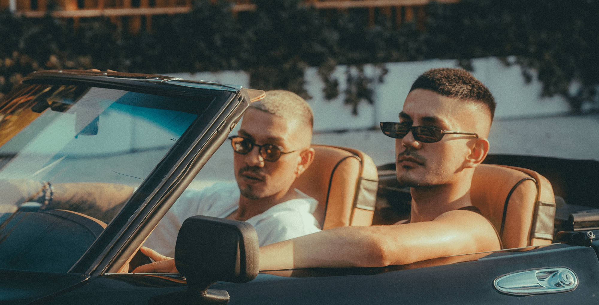 Miguelle and Tons together in a convertible