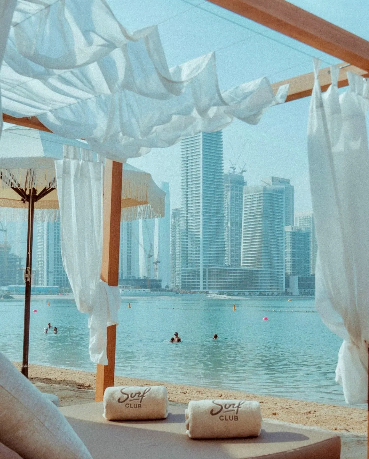 Shaded seating overlooking the water at Surf Club